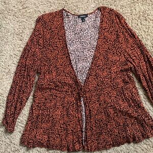 Women’s cheetah print top. Long sleeve with tie in the front. Torrid size 2